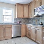 What defines a top cabinet design firm?
