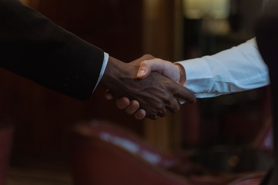 Business News for Today: SpaceX IPO and Iran Peace Deal 1 Handshake between diplomats symbolizing peace negotiations
